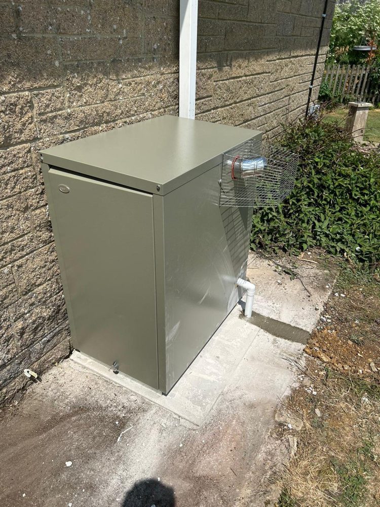 External oil boiler installed by Home Heroes at a Dorset village property